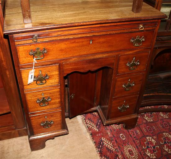 A George III mahogany kneehole desk, W.2ft 6in. D.1ft 8in. H.2ft 9in.
